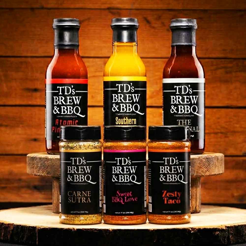 Collection of TD's Brew & BBQ products on a wooden surface with a wooden background.