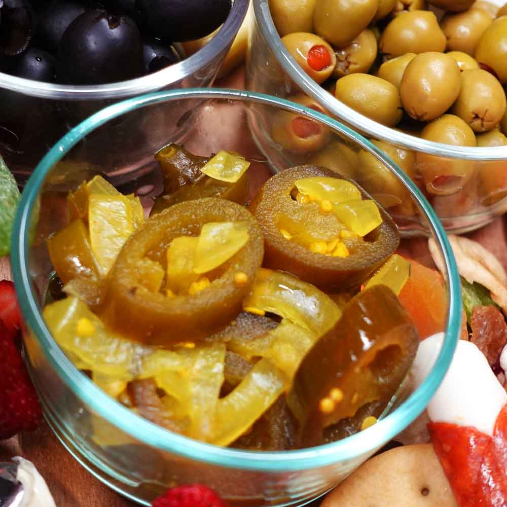 Jar of TD's Brew & BBQ Campfire Candy on a wooden surface with a wooden background