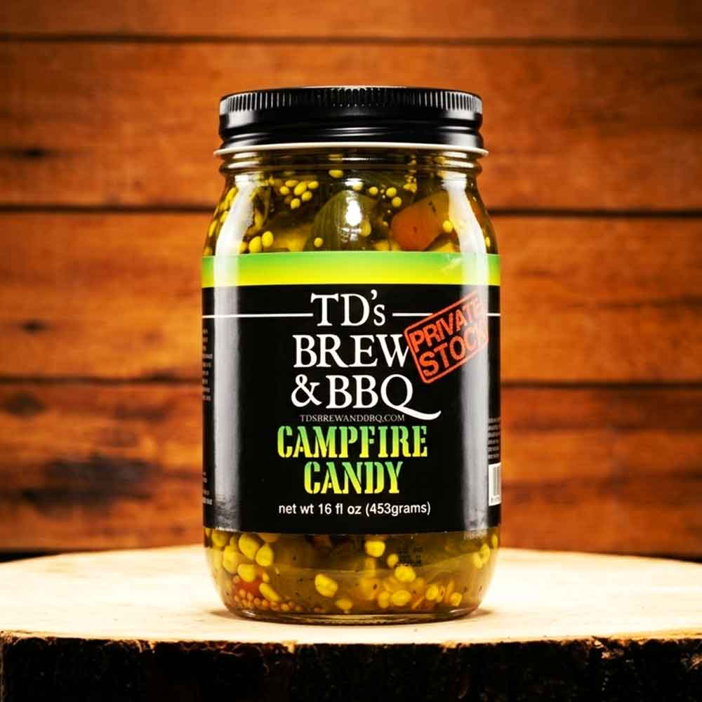 Jar of TD's Brew & BBQ Campfire Candy on a wooden surface with a wooden background