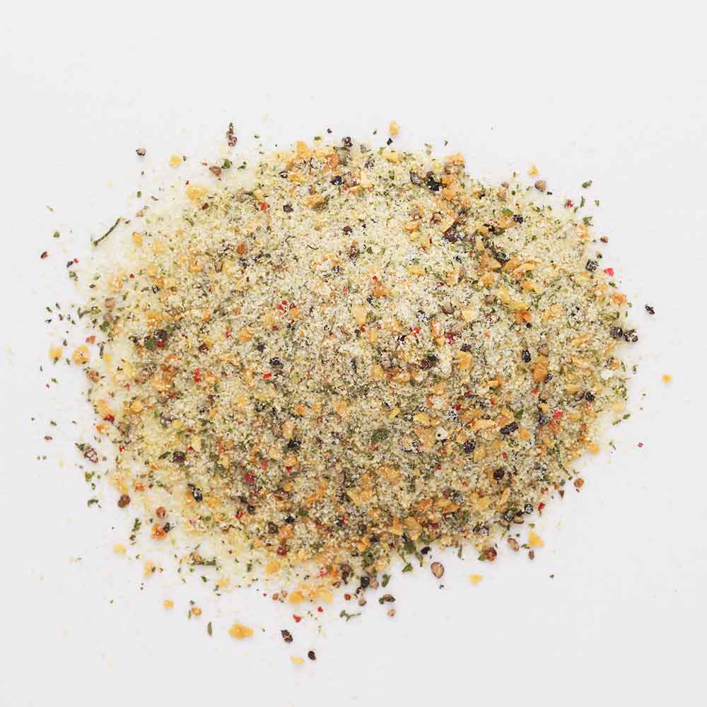 Assorted spices in a circular arrangement on a white background