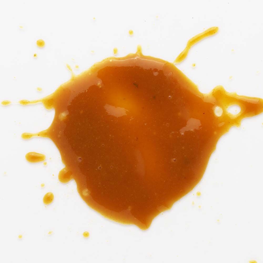 TDs Brew and BBQ Southern Mustard Sauce splatter on white background